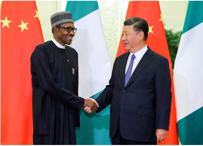 President Muhammadu Buhari in a handshake with President Xi Jinping